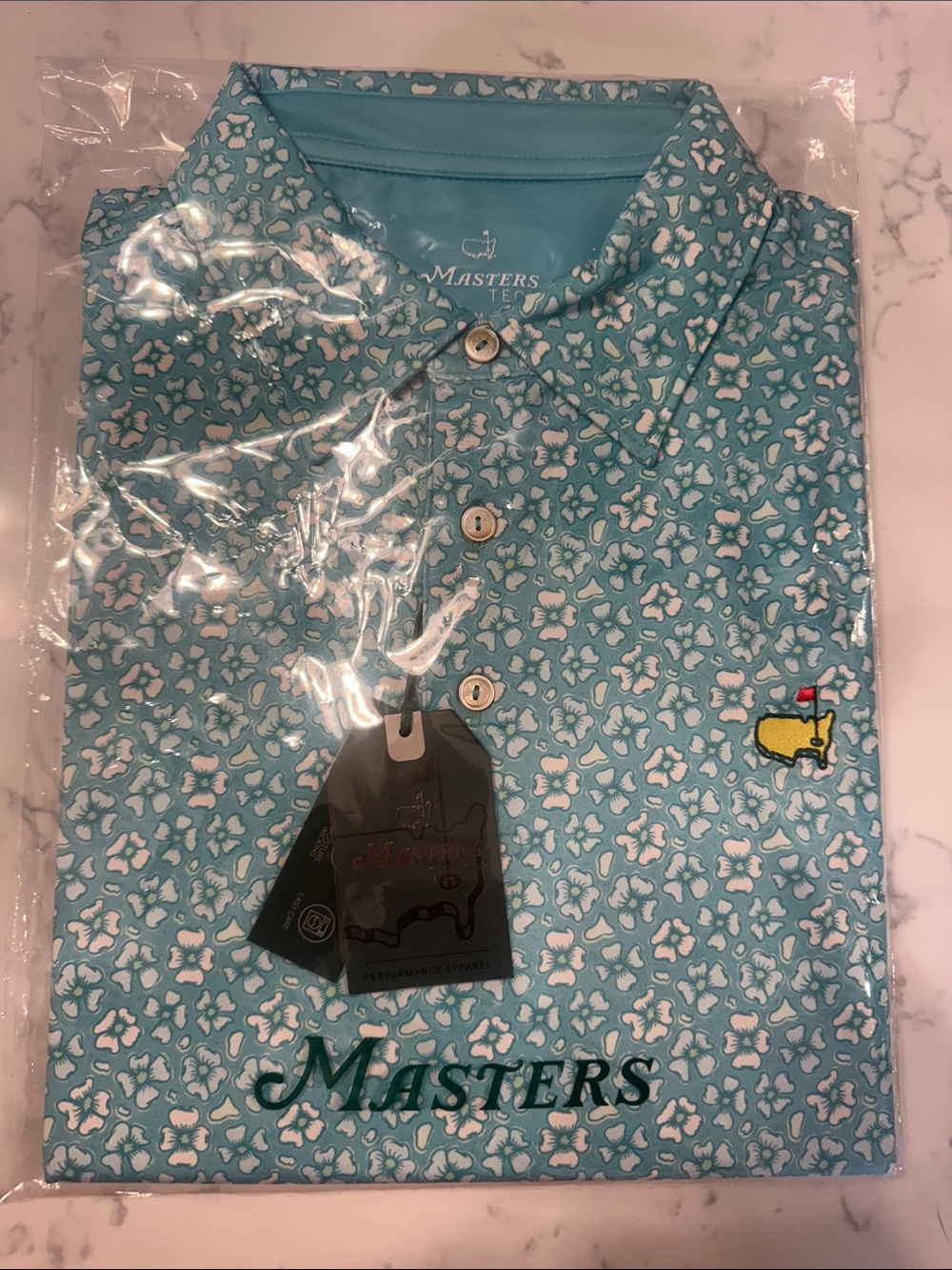 Masters Light Teal Floral Performance Polo with Yellow Emblem
